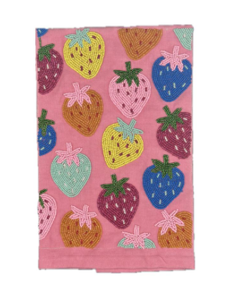 A pink fabric tea towel featuring a colorful embroidered pattern of strawberries in yellow, blue, purple, brown, and mint green.